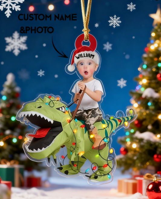Personalized Christmas ornament with a child riding a dinosaur, surrounded by festive decorations.