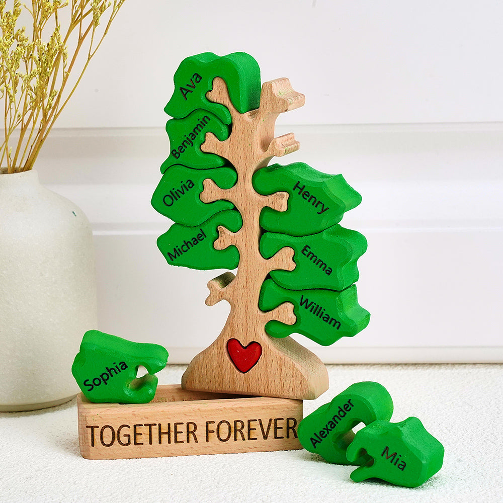 Wooden tree-shaped puzzle with green leaves and names, set against a white background.