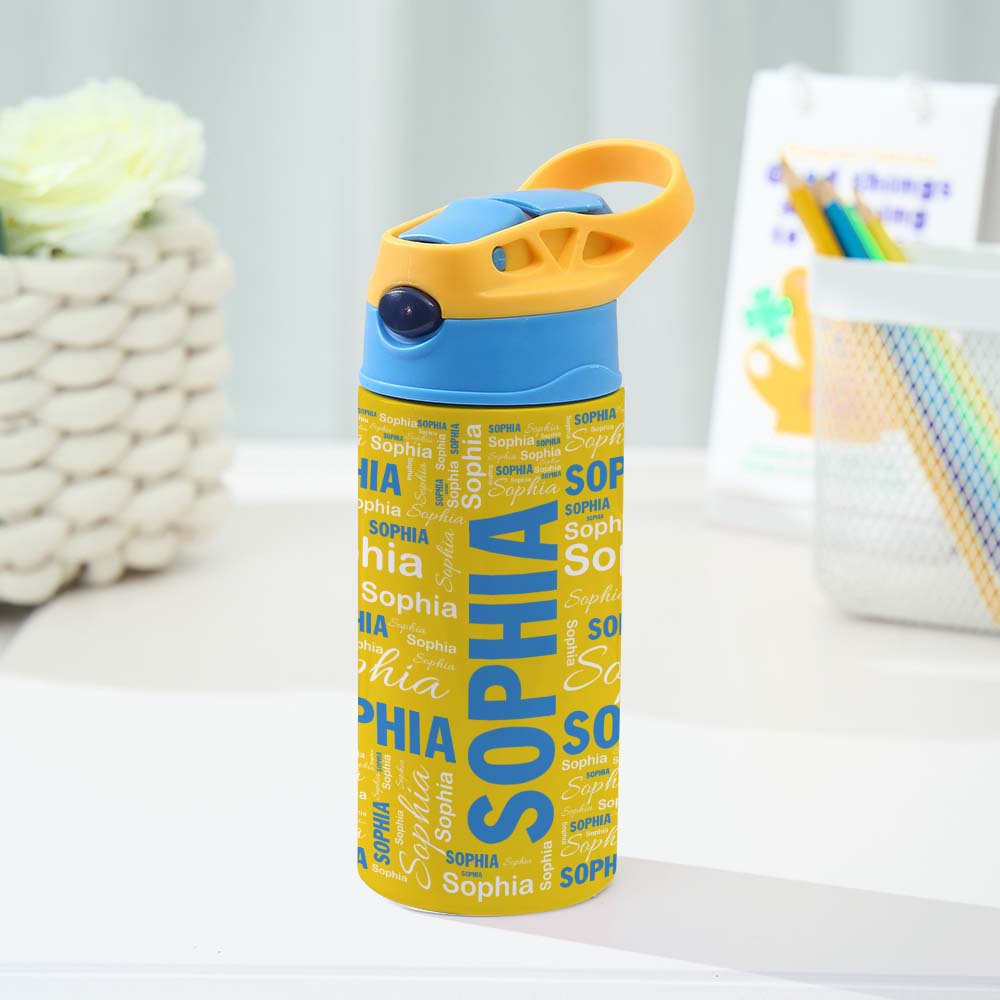 Yellow water bottle with 'Sophia' text and blue cap on a white surface.