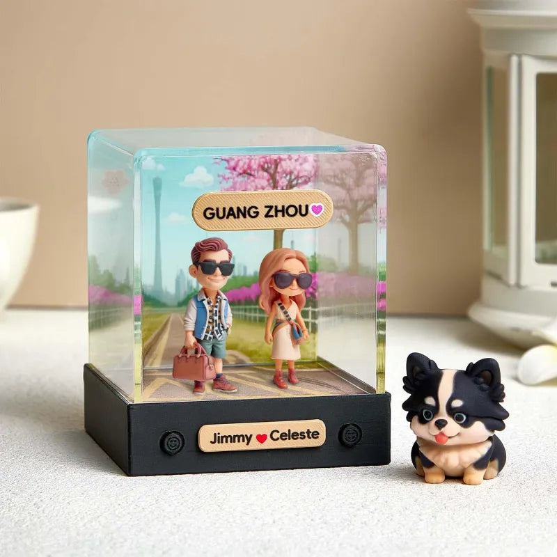 Personalized light box with figurines and a dog toy on a surface