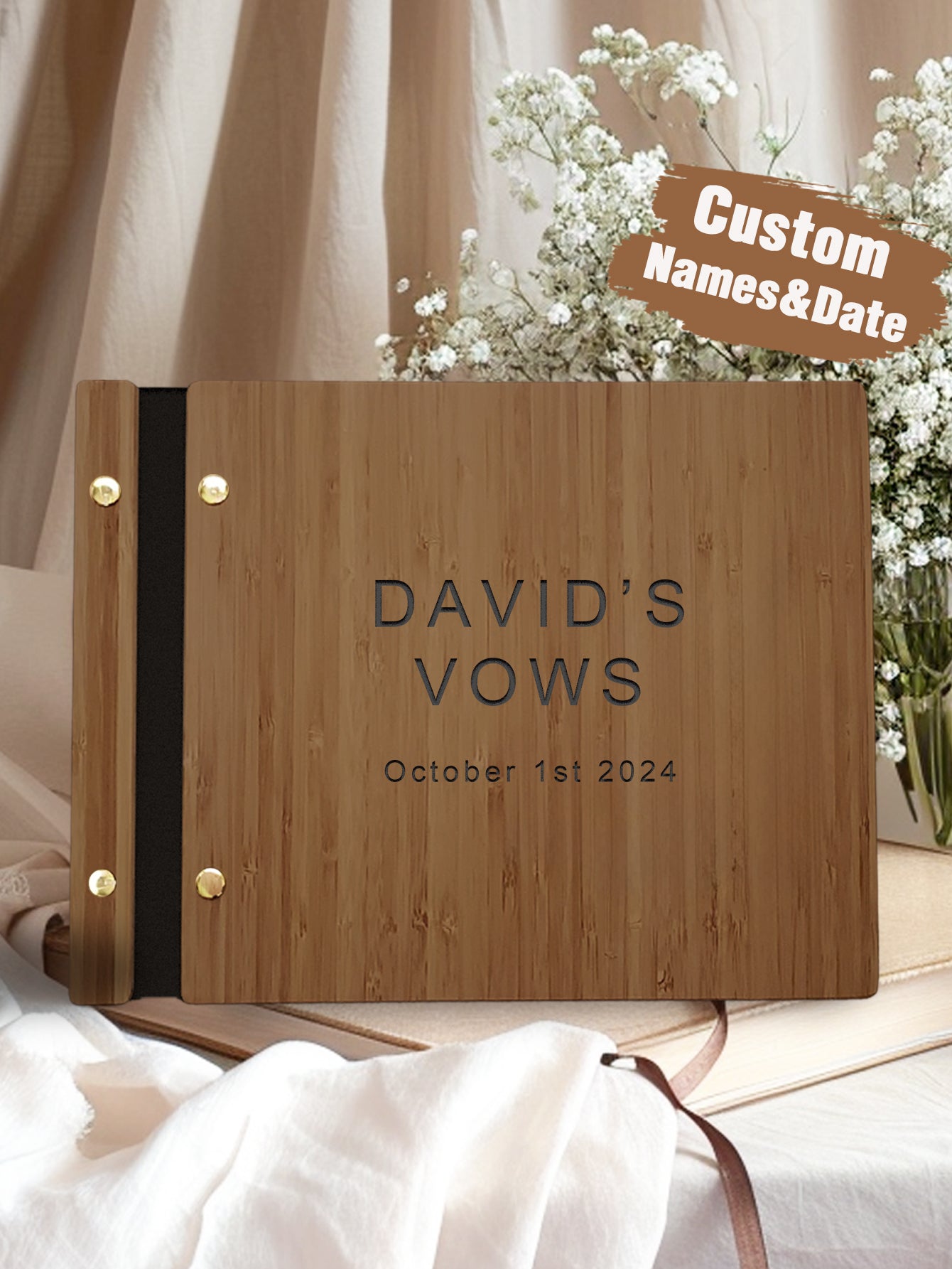 Wooden vow book with engraved text on a soft fabric background