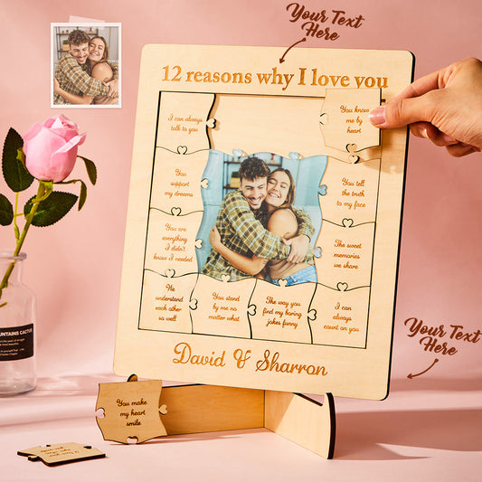 Personalized wooden puzzle with '12 reasons why I love you' text and a couple's photo, held by a hand on a pink background.