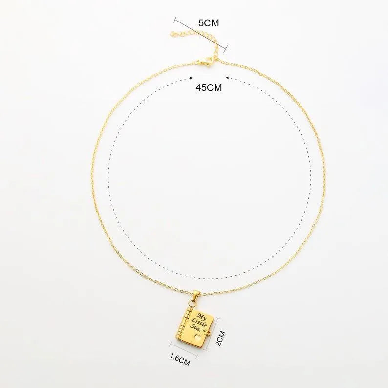 Gold necklace with a pendant, shown with measurements on a white background