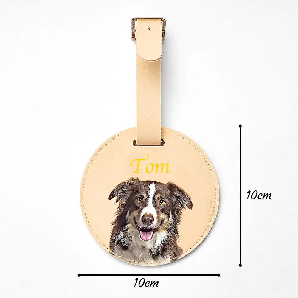 Round leather luggage tag with a dog's face and name 'Tom' on a white background