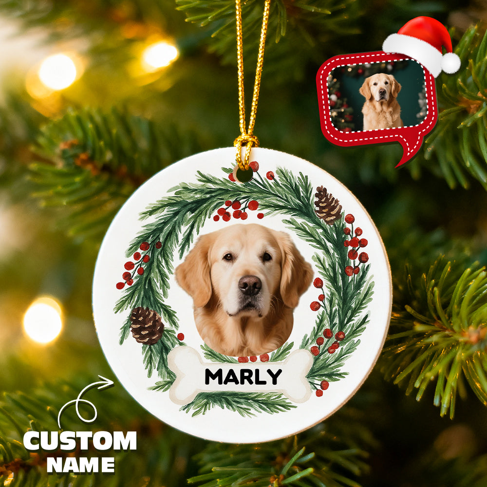 Christmas ornament with a dog's face, wreath, and 'Marly' text on a tree.