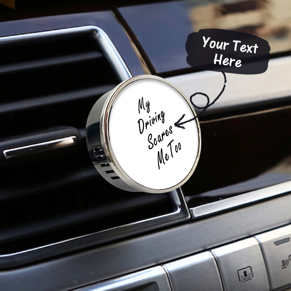 Car air freshener with humorous text on a car vent