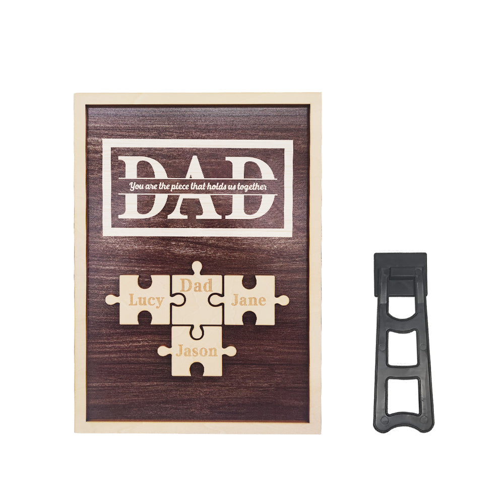 Wooden plaque with puzzle pieces and text, accompanied by a black bottle opener on a white background.