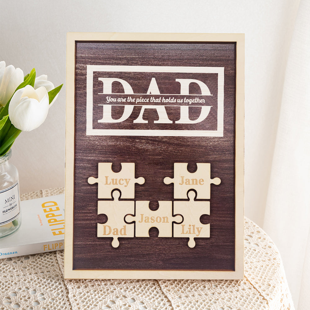 Personalized puzzle piece frame with names on a wooden background