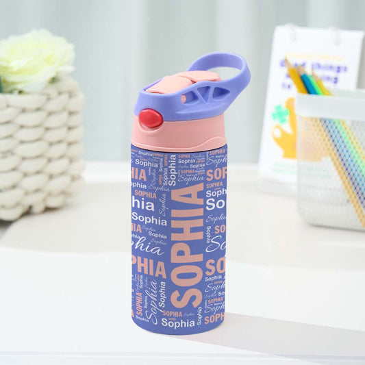 Personalized water bottle with 'Sophia' text on a white surface with a blurred background