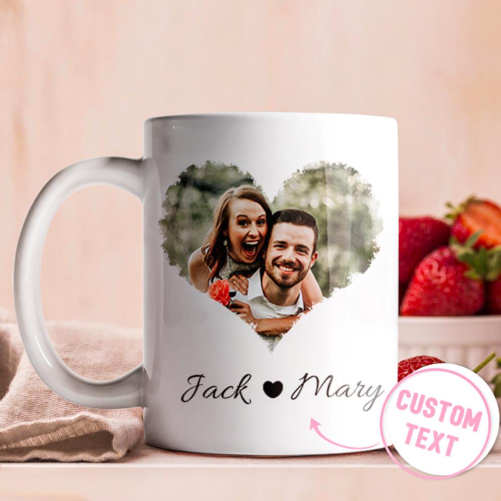 White mug with a printed photo of a couple and the text 'Jack & Mary' on a pink background.