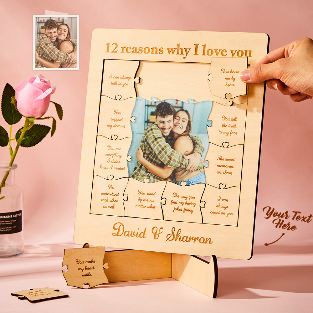 Wooden puzzle with '12 reasons why I love you' text and a couple's photo, held by a hand on a pink background.