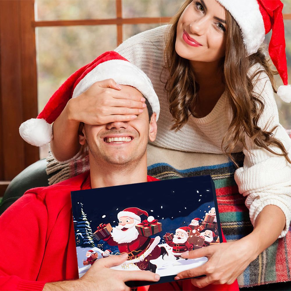 Woman covering a man's eyes with a Santa hat, both holding a Christmas-themed card.