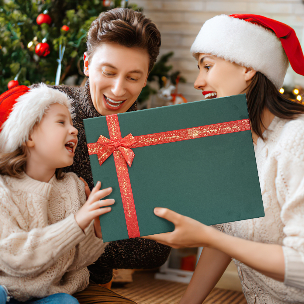 Family with a green gift box with a red ribbon in a festive setting.