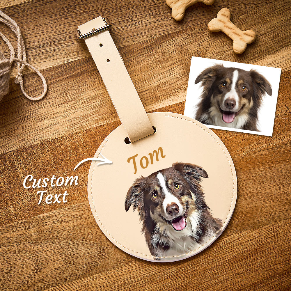 Round leather tag with a dog's face and 'Tom' text, on a wooden surface with dog toys.