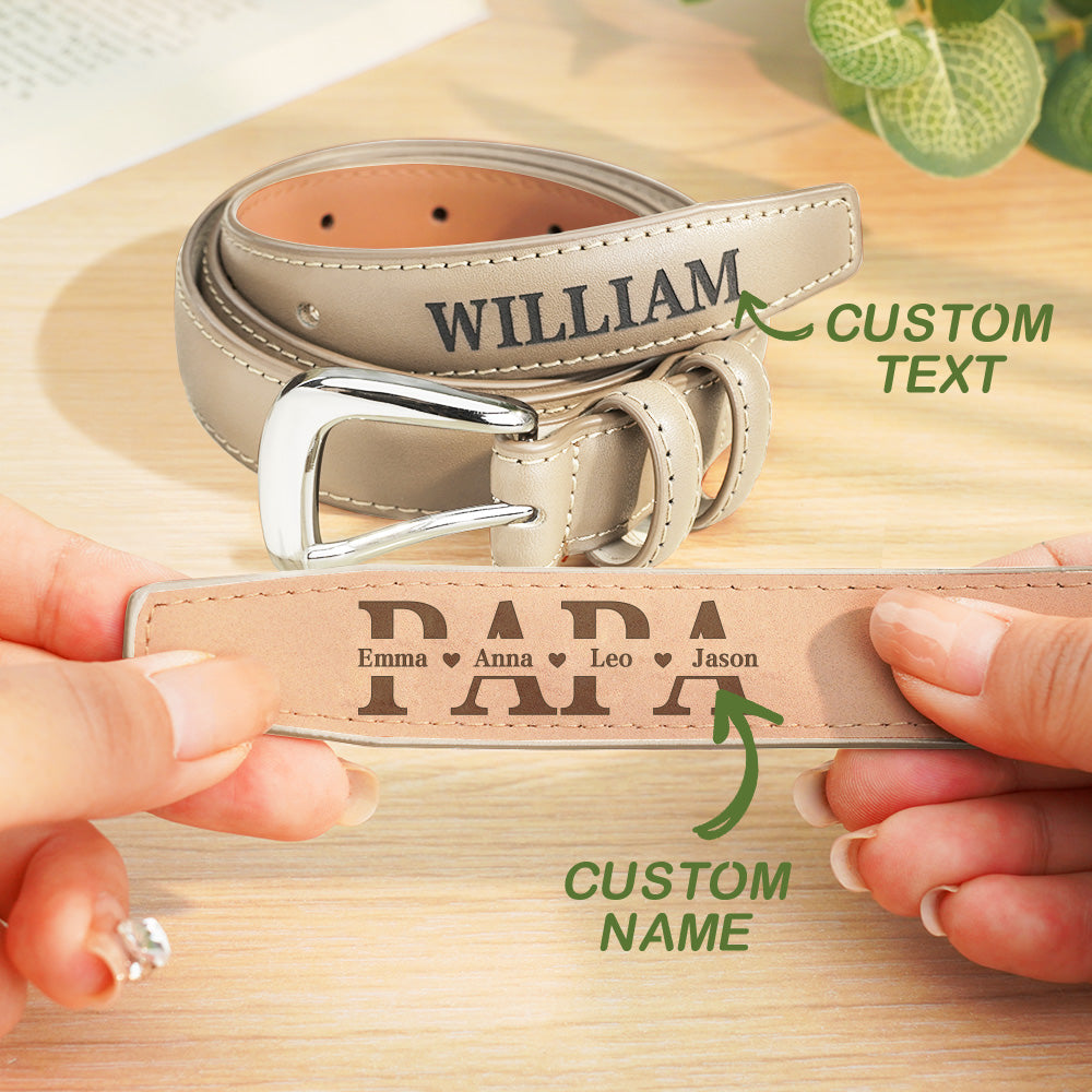 Personalized leather belts with customizable text on a wooden surface
