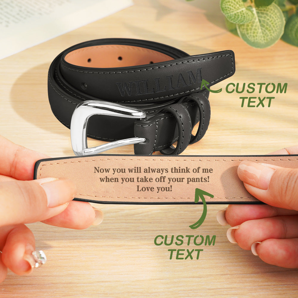 Black leather belt with customizable text on a wooden surface