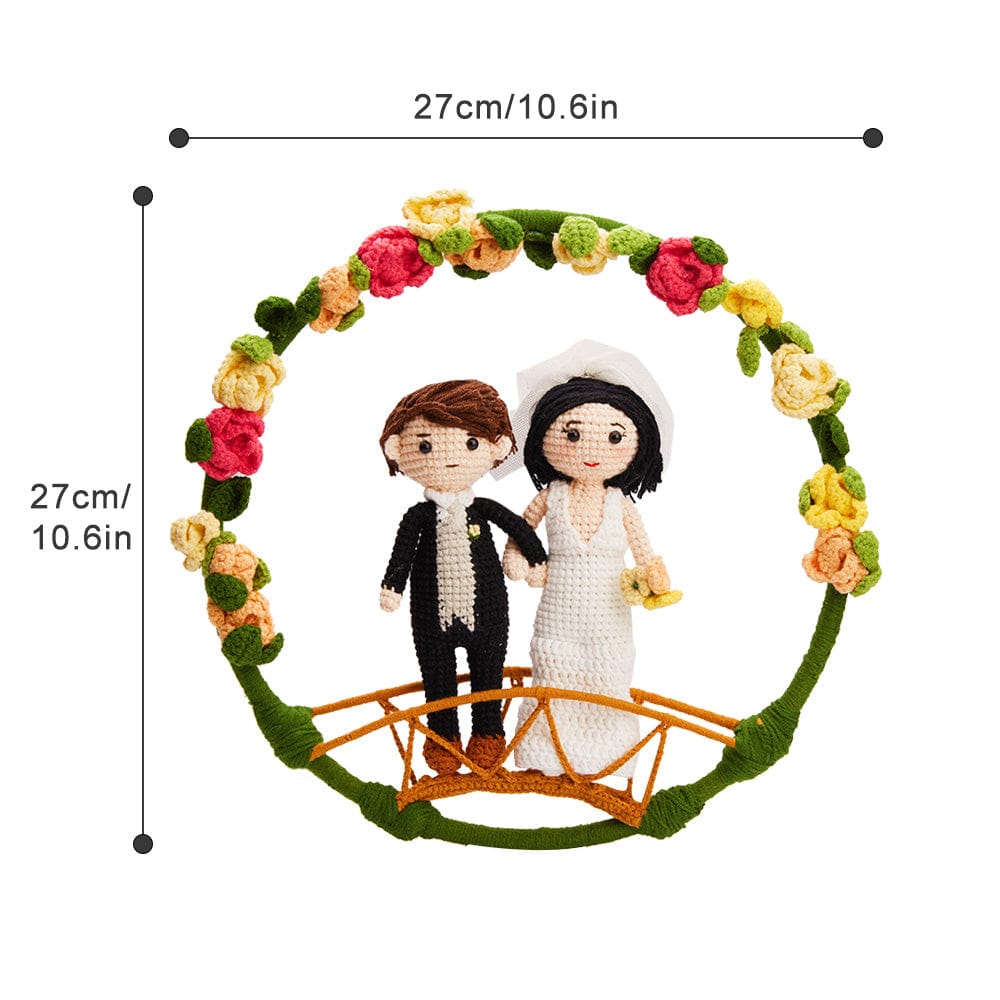 Decorative item with bride and groom figurines under a floral arch, with measurements indicated.