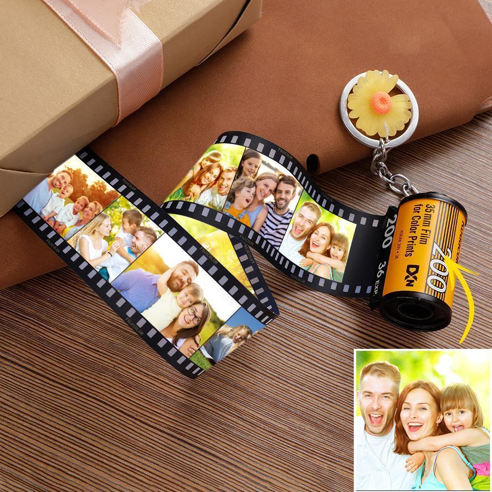 Film strip with photos and a roll of film on a wooden surface