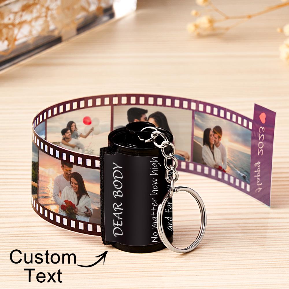 Personalized keychain with customizable text and photo strip on a wooden surface