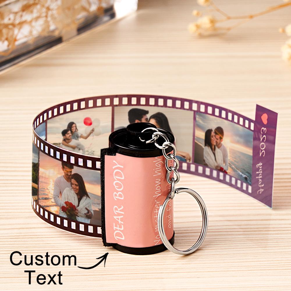 Personalized keychain with photo roll and 'Dear Body' text on a wooden surface