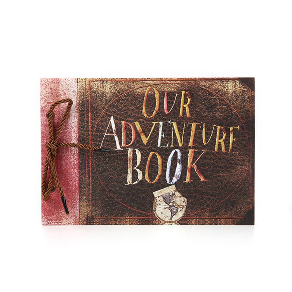 Book titled 'Our Adventure Book' with decorative elements on a white background