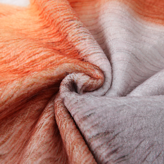 Close-up of orange and gray fabric with a soft texture.