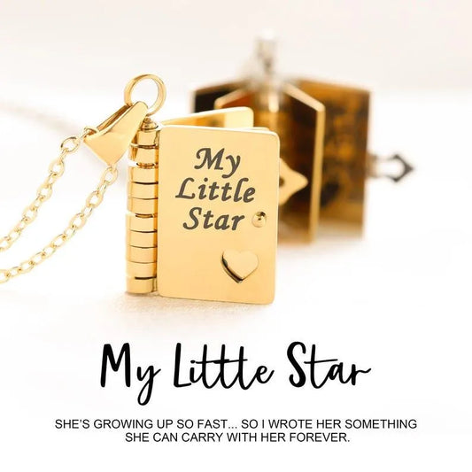 Gold necklace with book-shaped pendant and 'My Little Star' text on a white background.