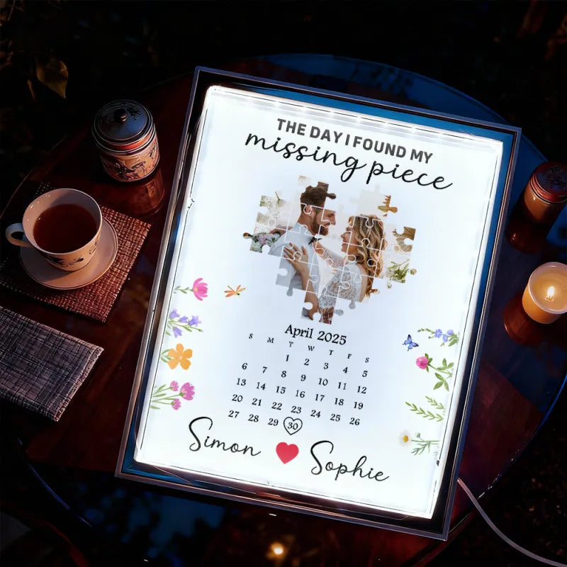 Calendar with personalized design on a table with a cup and bottle.