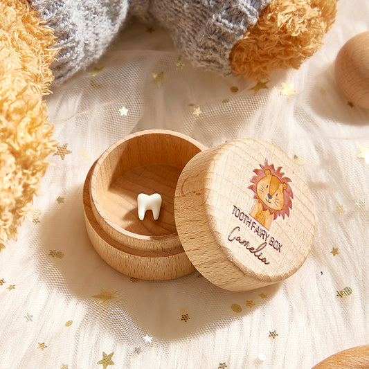 Wooden tooth fairy box with a lion design on a soft fabric background