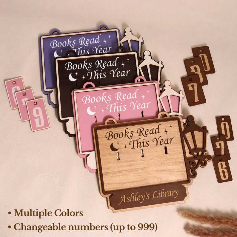 Wooden book tracker with 'Books Read This Year' labels and customizable numbers on a beige background.