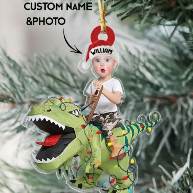 Personalized Christmas ornament with a child riding a dinosaur, customizable with name and photo.