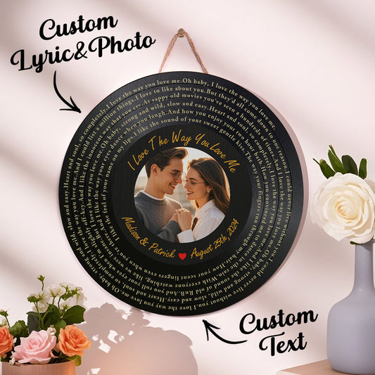 Personalized photo plaque with custom text and a couple's photo, surrounded by flowers and decor.