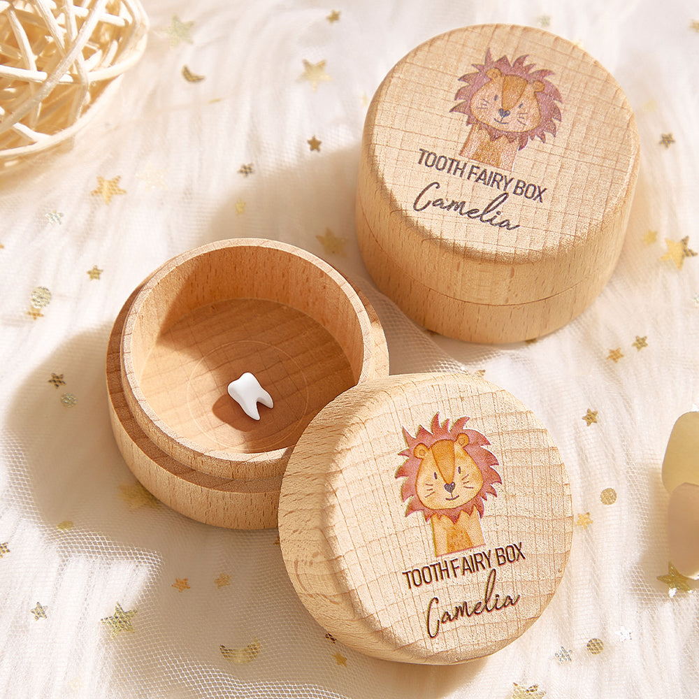 Wooden tooth fairy box with lion design and 'Camelia' engraving on a soft background.