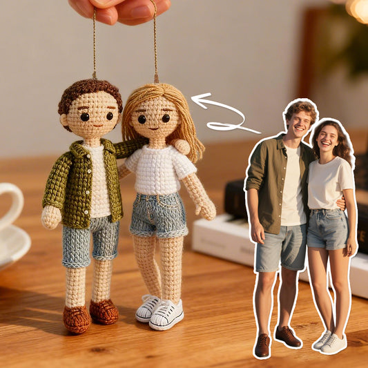 Crocheted dolls of a couple with an arrow pointing to a real-life photo of the same couple.