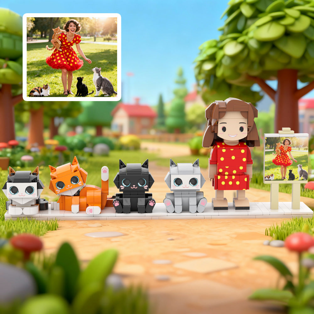 Toy figures of a girl and her pets in a park setting with a real-life photo inset.